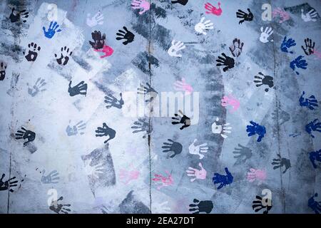 Mural Touch The Wall, Mural Hands with Handprints, detail view, artist Christine Kuehn, East Side Gallery, Mauergalerie, Berlin, Germany Stock Photo