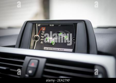 Car tyre pressure safety monitoring system for run flat wheels displayed on colour vehicle entertainment screen display showing green with no faults Stock Photo