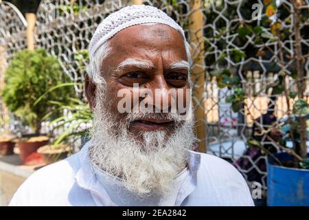 Imam in front of the Star Mosque (Tara Masjid), Dhaka, Bangladesh Stock Photo