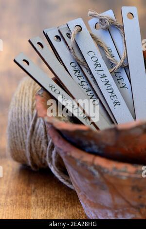 Signs in clay pot, plant inscriptions, plant labels Stock Photo