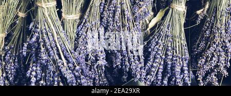 Dry Lavender bunches selling at outdoor french market in Provence. Top view composition. Mobile photography Stock Photo