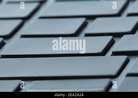 Gray laptop keyboard close-up without inscriptions. Selective focus on enter buttons. Abstract tile Stock Photo