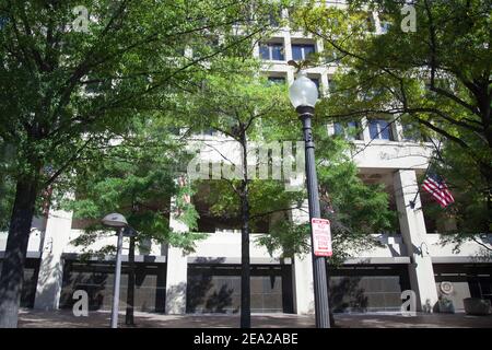 FBI building close-up in Washington USA. Building on a background of green trees in summer Stock Photo