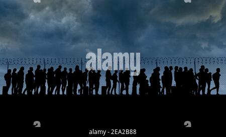 Refugees and immigrants looking for a new life. Column of migrants near the state borders. Fence and barbed wire. Surveillance, supervised. Silhouette Stock Photo