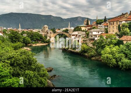 Stari Most / Mostar Bridge and over the Neretva River in Mostar, Bosnia and Herzegovina. Stock Photo