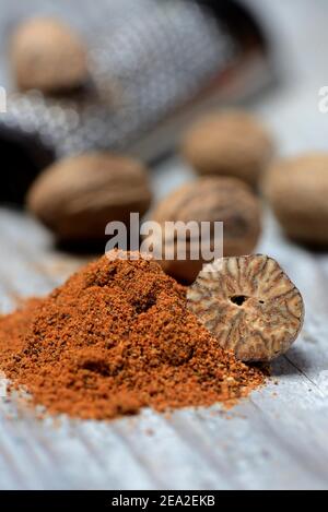 Nutmegs and nutmeg powder with grater, ground, nutmeg grater ( Myristica fragrans) Stock Photo