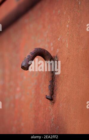 Close up af weathered rusty metal hook. Stock Photo