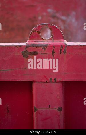 Close up af weathered red metal part with rust stains. Stock Photo