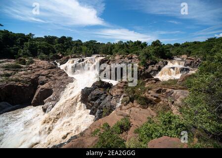 The scenic beauty of a strongly flowing river gushing over rocks Stock Photo