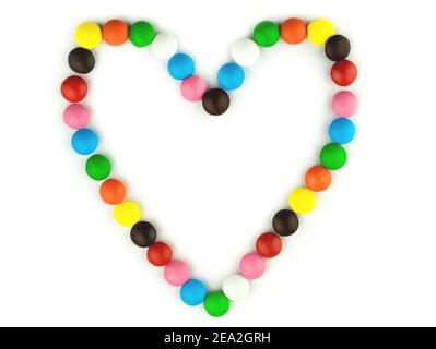 Bright candy pills on white isolated background. Frame for your photo or text. Stock Photo
