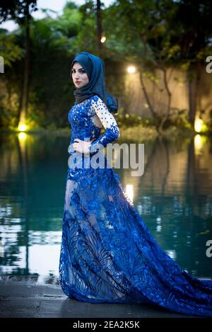 Model dressed in Modest fashion designed by Mira Indria in