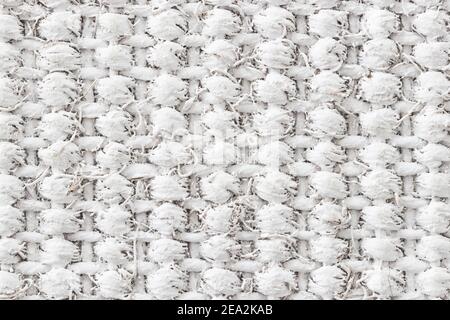 Horizontal and vertical pattern of a woven reed mat painted white. Stock Photo