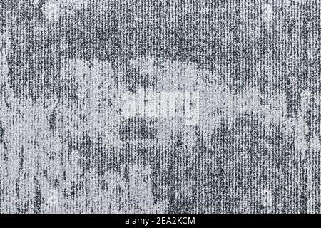 Detail of a gray dual toned carpet with vertical lines and an abstract pattern. Stock Photo