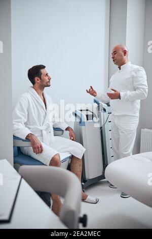 Attractive man spending day in modern hospital Stock Photo