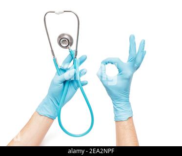 A doctor in a medical glove holds on to the groin area of a male patient.  Concept of genitourinary diseases, varicocele and prostatitis in men Stock  Photo