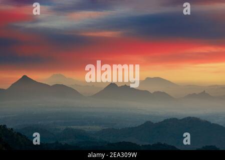 A view of tea plantations filled with mist in the highlands of Ella, Sri Lanka. Stock Photo