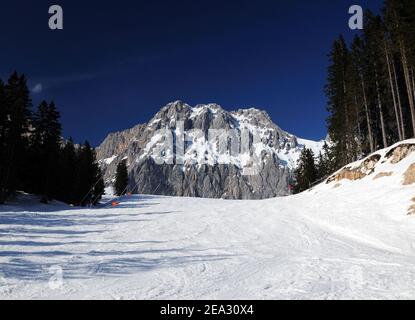 Ski Area Ehrwalder Alm With View To Mount Zugpitze Austria On A Beautiful Sunny Winter Day With  a Clear Blue Sky Stock Photo