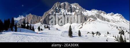 Ski Area Ehrwalder Alm With View To Mount Zugpitze Austria On A Beautiful Sunny Winter Day With  a Clear Blue Sky Stock Photo