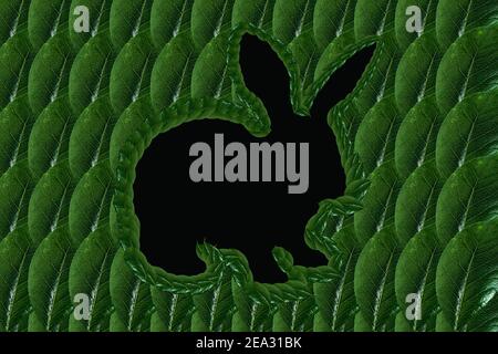 Easter bunny from green leaves. Flat lay. Natural spring concept Stock Photo