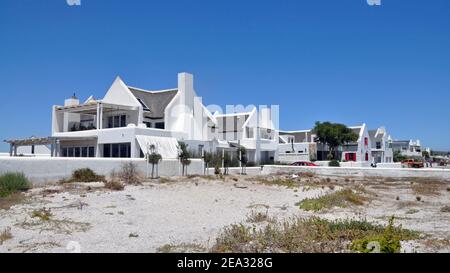 Holiday homes in the fishing village of Paternoster, a popular tourist destination on the West Coast of South Africa. Stock Photo