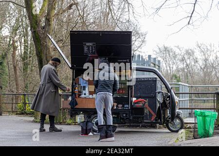 Cardiff, Wales - February 3rd 2021:  People engage in their daily exercise, around Cardiff's various parks, as implemented by the Welsh Government Stock Photo