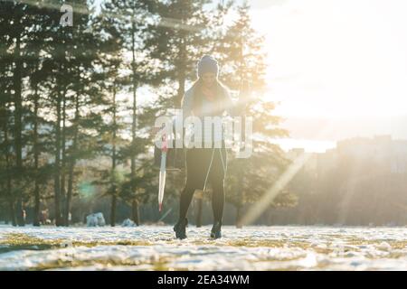 Woman walking thru slushy snow Stock Photo