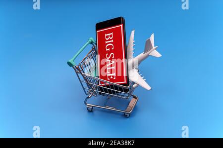 Shopping cart with plane toy. Air tickets sale concept. Stock Photo