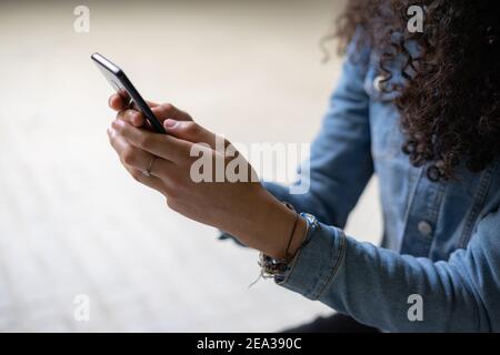 Hands holding a cell phone Stock Photo