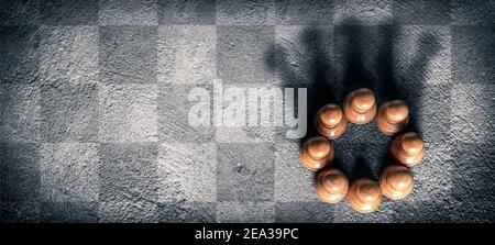 Group Of Pawns On Chessboard Creating Shadow Of Kings Crown - Business Teamwork Concept Stock Photo