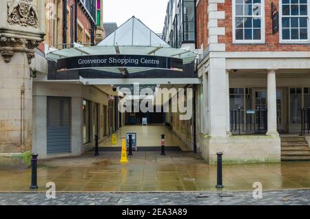 Chester; UK: Jan 29, 2021: The Eastgate Street entrance to the Grosvenor Shopping Centre which is temporarily closed during the corona virus lockdown. Stock Photo