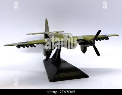 Photo of a Die cast model of a de Havilland DH.98 Mosquito fighter bomber from World War II on a black plastic stand against a white background Stock Photo