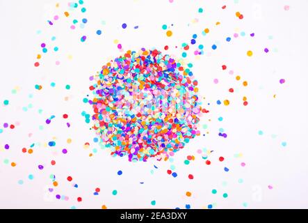 colorful confetti on a white background. Top view. Stock Photo