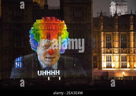 People Stop To Look At A Projection On The Side Of The Houses Of Parliament In London In Response Of The Public S Feedback On Prime Minister Boris Johnson Picture Date Sunday February