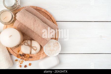 Cleaning kit with candles on a wooden background. Top view with copy space. Stock Photo