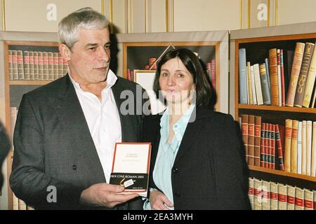 Jury member French actor Jacques Weber poses with prize winner Catherine Guillebaud for her novel 'La Fille du Bar' during the 'Carte Noire Cine Roman Awards' at hotel Plaza Athene in Paris, France on April 3, 2005. Photo by Benoit Pinguet/ABACA. Stock Photo