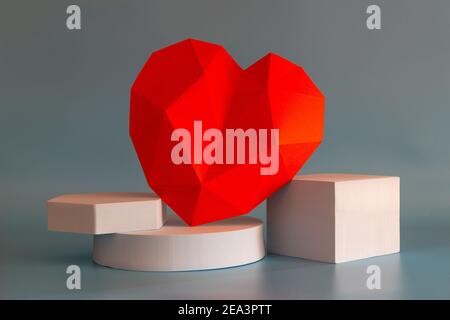 Abstract composition with geometric shapes forms and red polygonal heart on light gray background Stock Photo