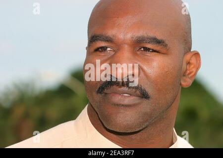 Legendary American boxer 'four times Heavyweight World Champion' Evander Holyfield poses at the Hilton Hotel during the MIPTV 2005 in Cannes, France on April 13, 2005 to promote his autobiographic documentary TV, 'The Real Deal'. Photo by Gerald Holubowicz/ABACA. Stock Photo