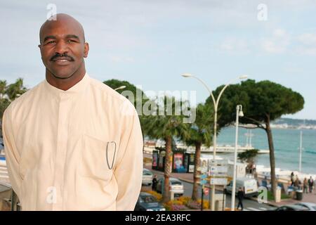 Legendary American boxer 'four times Heavyweight World Champion' Evander Holyfield poses at the Hilton Hotel during the MIPTV 2005 in Cannes, France on April 13, 2005 to promote his autobiographic documentary TV, 'The Real Deal'. Photo by Gerald Holubowicz/ABACA. Stock Photo