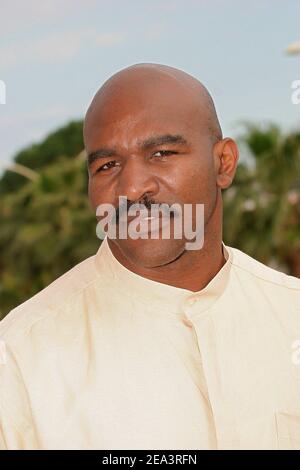 Legendary American boxer 'four times Heavyweight World Champion' Evander Holyfield poses at the Hilton Hotel during the MIPTV 2005 in Cannes, France on April 13, 2005 to promote his autobiographic documentary TV, 'The Real Deal'. Photo by Gerald Holubowicz/ABACA. Stock Photo