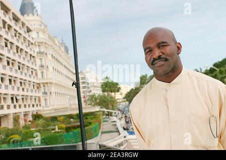 Legendary American boxer 'four times Heavyweight World Champion' Evander Holyfield poses at the Hilton Hotel during the MIPTV 2005 in Cannes, France on April 13, 2005 to promote his autobiographic documentary TV, 'The Real Deal'. Photo by Gerald Holubowicz/ABACA. Stock Photo