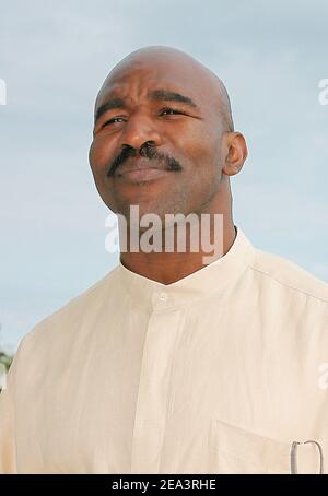 Legendary American boxer 'four times Heavyweight World Champion' Evander Holyfield poses at the Hilton Hotel during the MIPTV 2005 in Cannes, France on April 13, 2005 to promote his autobiographic documentary TV, 'The Real Deal'. Photo by Gerald Holubowicz/ABACA. Stock Photo