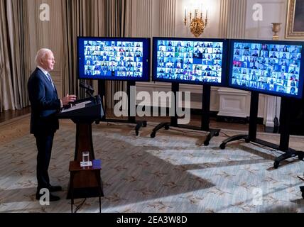 U.S President Joe Biden participates in a virtual swearing-in ceremony of top aides and appointees from the State Dining Room of the White House January 20, 2021 in Washington, D.C. Stock Photo