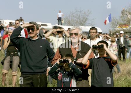 Spectators watching the Airbus A380, the world's largest passenger plane, taking off successfully on its maiden flight at Blagnac airport near Toulouse, southwestern France, on Wednesday April 27, 2005. The 555-seat superjumbo is expected to enter service in mid-2006. Photo by Mousse-Soussan-Zabulon/ABACA. Stock Photo