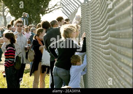 Spectators watching the Airbus A380, the world's largest passenger plane, taking off successfully on its maiden flight at Blagnac airport near Toulouse, southwestern France, on Wednesday April 27, 2005. The 555-seat superjumbo is expected to enter service in mid-2006. Photo by Mousse-Soussan-Zabulon/ABACA. Stock Photo