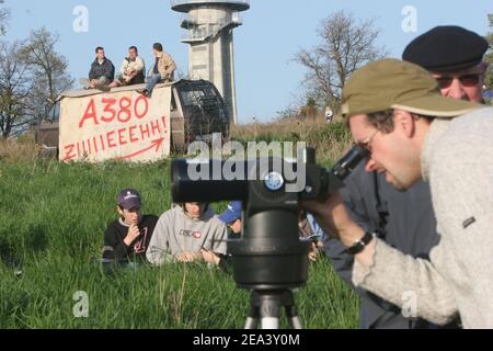 Spectators watching the Airbus A380, the world's largest passenger plane, taking off successfully on its maiden flight at Blagnac airport near Toulouse, southwestern France, on Wednesday April 27, 2005. The 555-seat superjumbo is expected to enter service in mid-2006. Photo by Mousse-Soussan-Zabulon/ABACA. Stock Photo