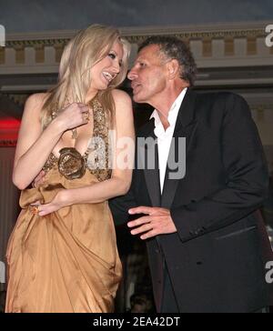 EXCLUSIVE. French TV man Patrick Poivre d'Arvor and Adriana Karembeu had a passionate dance during the 'Run For Life' party for the benefit of the Red Cross, organized by Cynthia Sarkis Perros and held at Majestic hotel in Cannes on May 14, 2005. Dress: Elie Saab, Jewels: Boucheron, Hairdress: Franck Provost, Make Up: Christian Dior. Photo by Nebinger-Hahn-Klein/ABACA Stock Photo
