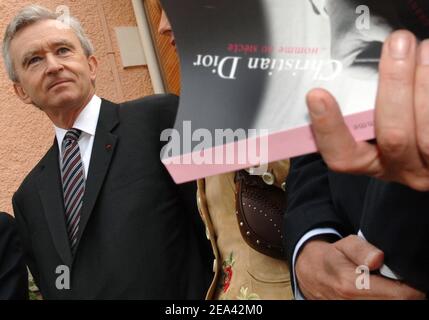 LVMH CEO, Bernard Arnault signs the Gold Book for the opening of Christian  Dior's house and museum in Granville, Britain coast of France on May 14,  2005 for the celebration of the