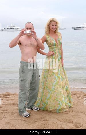Australian actress and model Kristy Hinze and actor Gimonen pose during a photocall for the film 'Extra' on the beach of Majestics Hotel during the 58th International Cannes Film Festival, in Cannes, France on May 16, 2005. Photo by Benoit Pinguet/ABACA. Stock Photo