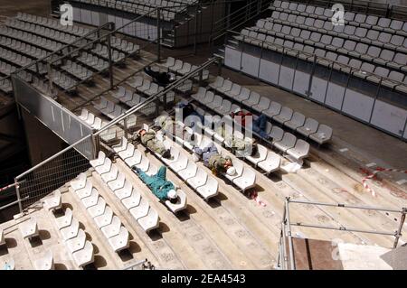 EXCLUSIVE. Chinese workers start building a 150m stage set to recreate Beijing's Forbidden City inside the Stade de France stadium, near Paris, France, on May 16, 2005, for a spectacular production of Puccini's Opera 'Turandot' by Chinese director Zhang Yimou, to be staged live on May 28, with 450 performers of the China National Dance Ensemble wearing 1,000 embroidered silk costumes. Photos by Stephane Kempinaire-Nicolas Gouhier/CAMELEON/ABACA. Stock Photo