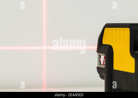 Electronic laser pointing straight lines. Checking angles and setting points while taking measurements Stock Photo